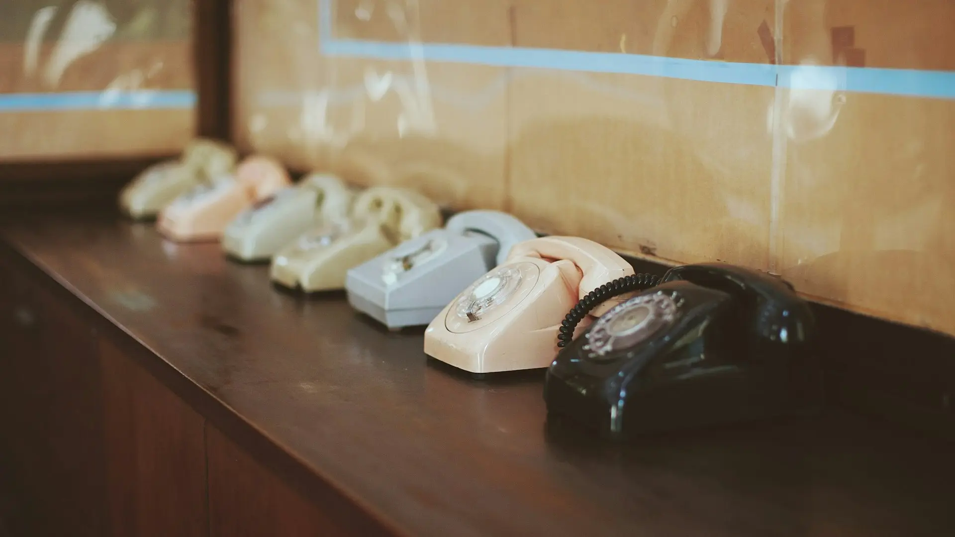 white telephone on brown wooden table